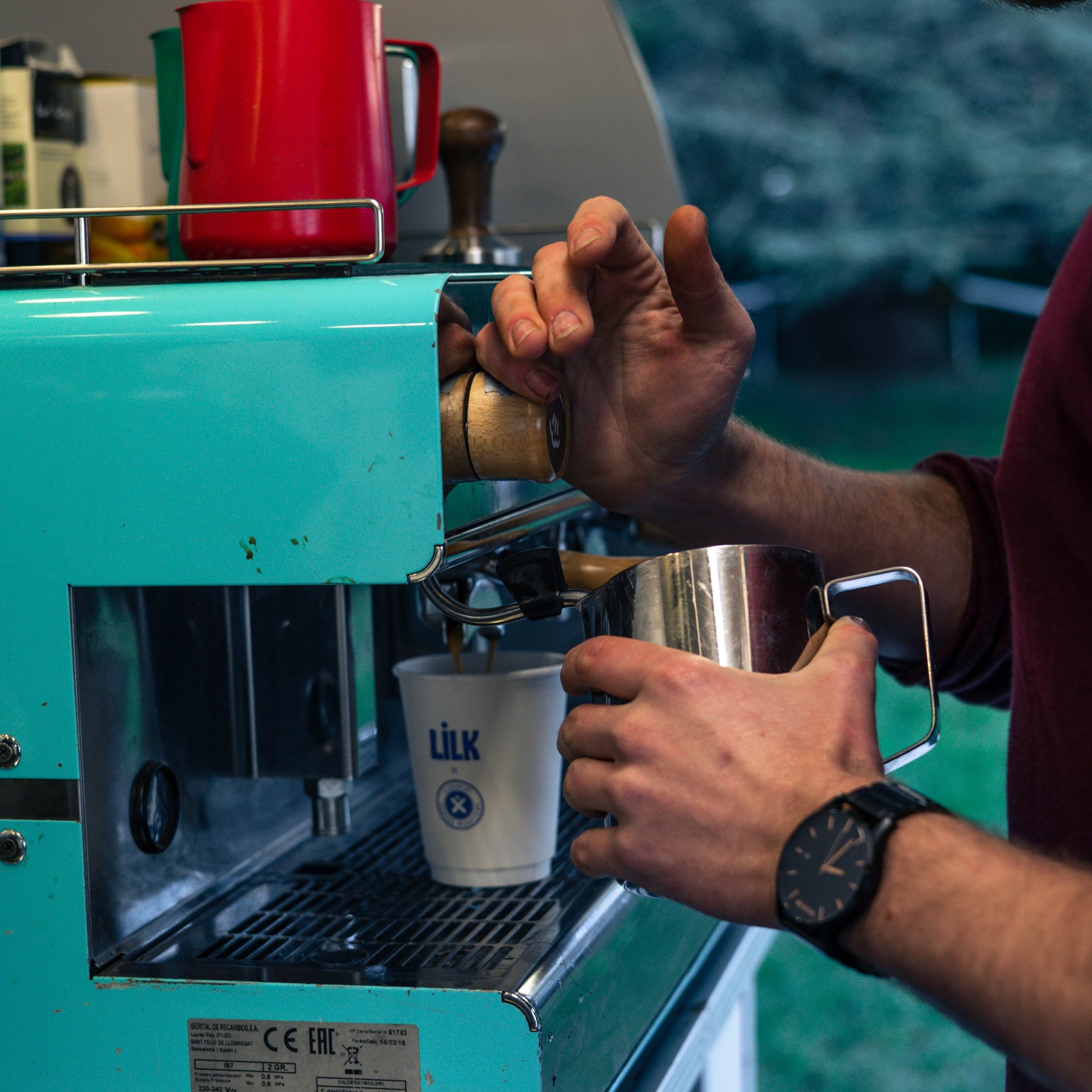 A barista steaming milk